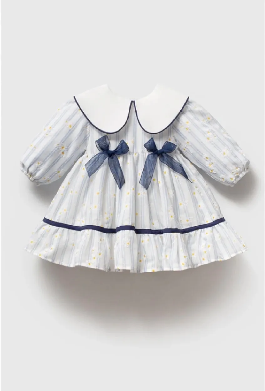 A classic, elegant dress with a touch of blue.