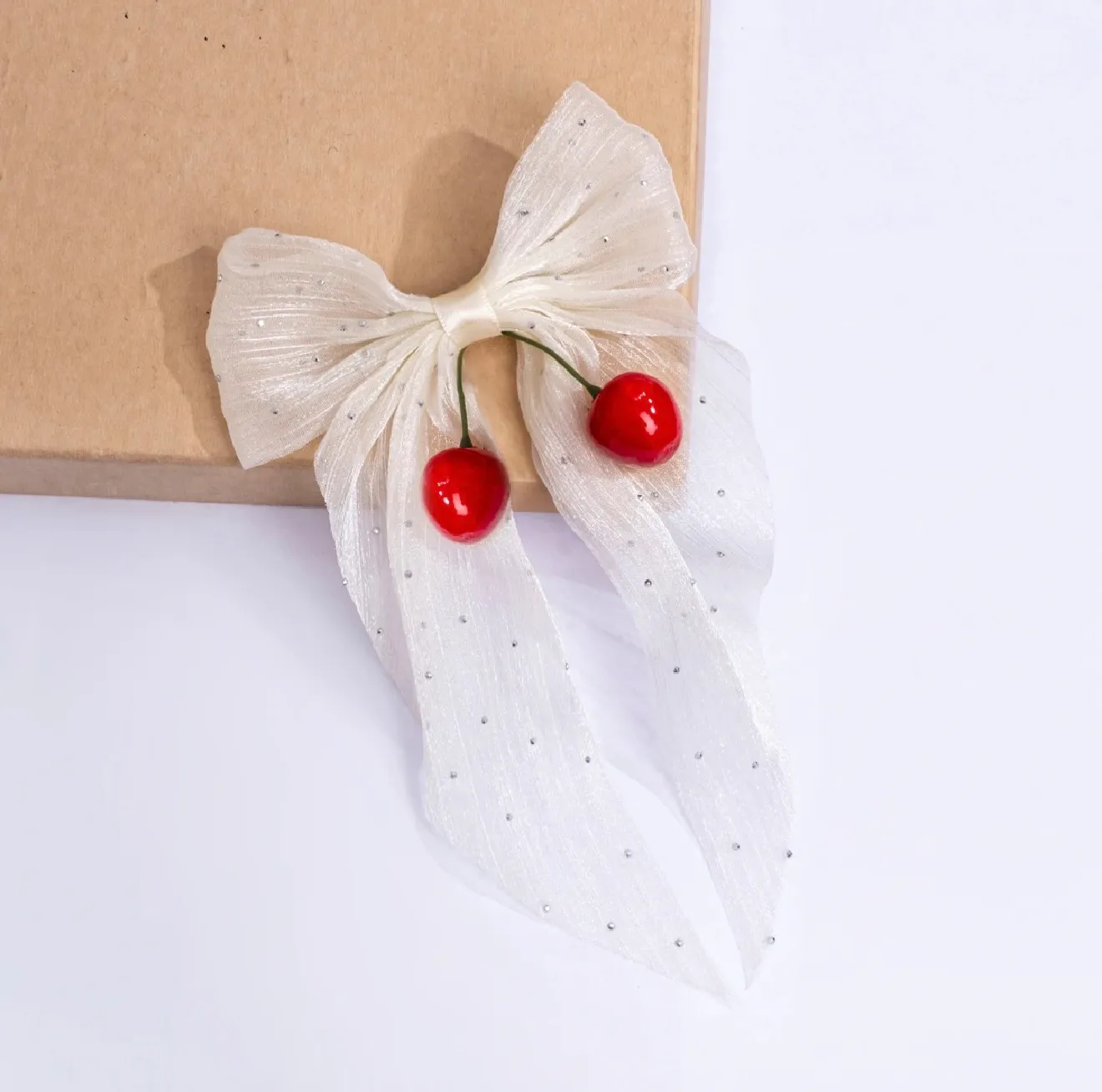 Ivory bow with red cherry